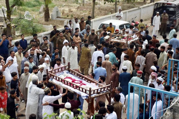 (260701) -- LAHORE, July 1, 2026 -- People attend the funeral of children died after the roof of a private tuition center collapsed in Lahore, Pakistan, July 1, 2026. At least 14 children were killed and several others injured after the roof of a private tuition center collapsed in Pakistan s eastern city of Lahore on Tuesday, rescue officials told Xinhua. (Photo by Xinhua) PAKISTAN-LAHORE-TUITION CENTER-ROOF COLLAPSE-AFTERMATH Sajjad 