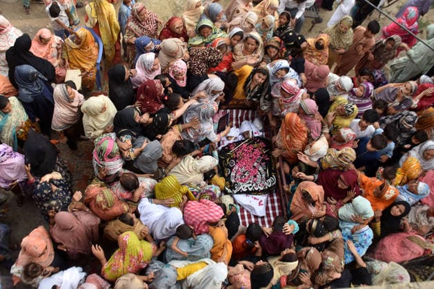 (260701) -- LAHORE, July 1, 2026 -- People attend the funeral of children died after the roof of a private tuition center collapsed in Lahore, Pakistan, July 1, 2026. At least 14 children were killed and several others injured after the roof of a private tuition center collapsed in Pakistan s eastern city of Lahore on Tuesday, rescue officials told Xinhua. (Photo by Xinhua) PAKISTAN-LAHORE-TUITION CENTER-ROOF COLLAPSE-AFTERMATH Sajjad 