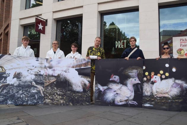 July 1, 2026, Ascot, England, United Kingdom: Naturalist and TV presenter CHRIS PACKHAM (c) stands with activists holding photos of chickens outside Pret in Waterloo during a protest urging the public to skip the fast food chain until they stop selling meat from Frankenchickens. Frankenchickens are chickens bred to grow artificially fast, and campaigners say they suffer far more than regular chickens. Ascot United Kingdom - ZUMAv130 20260701_zip_v130_034 Copyright: xVukxValcicx