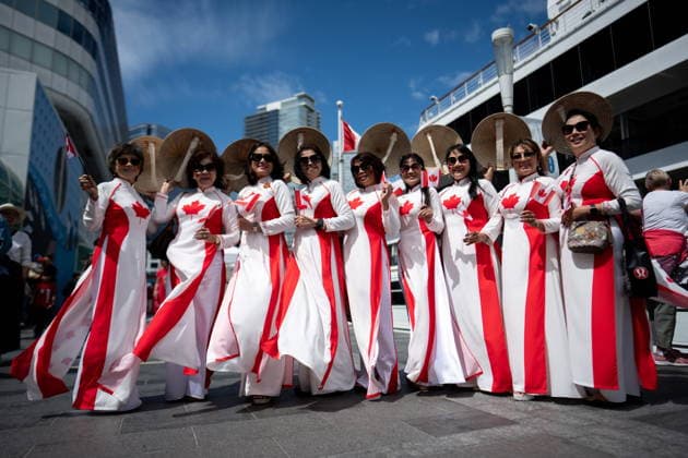 July 1, 2026, Vancouver, Bc, CANADA: A group of Vietnamese women dressed in Canada dresses pose for a photo during Canada Day Celebrations in Vancouver, on Wednesday, July 1, 2026. Vancouver CANADA  - ZUMAc35_ 20260701_zaf_c35_074 Copyright: xEthanxCairnsx