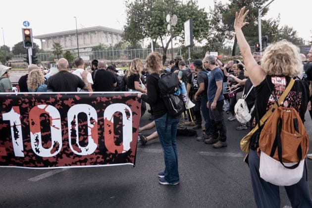 July 2, 2026, Jerusalem, Israel: Anti government protesters deploy a massive crate to block the main intersection outside the Knesset during a nationwide Day of Rage. Activists gathered at exactly 6:29 a.m. to mark the 1,000th day since the October 7, 2023 attacks, which they have dubbed the Netanyahu Massacre, demanding accountability for the government s failure to prevent the initial attacks, secure the release of all hostages alive, the ongoing 3 year war and for establishing a state commission of inquiry. Jerusalem Israel - ZUMAa126 20260702_zap_a126_008 Copyright: xNirxAlonx