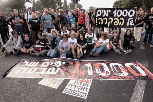 July 2, 2026, Jerusalem, Israel: Anti government protesters deploy a massive crate to block the main intersection outside the Knesset during a nationwide Day of Rage. Activists gathered at exactly 6:29 a.m. to mark the 1,000th day since the October 7, 2023 attacks, which they have dubbed the Netanyahu Massacre, demanding accountability for the government s failure to prevent the initial attacks, secure the release of all hostages alive, the ongoing 3 year war and for establishing a state commission of inquiry. Jerusalem Israel - ZUMAa126 20260702_zap_a126_014 Copyright: xNirxAlonx