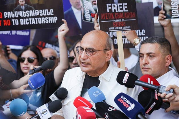 ARMENIA, YEREVAN - JULY 2, 2026: Political scientist Stepan Danielyan talks to journalists during a protest outside the Government House amid talks between European Commission President von der Leyen and Armenia s President Pashinyan. Alexander Patrin TASS  94569545