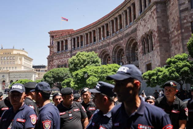 ARMENIA, YEREVAN - JULY 2, 2026: Police officers stand guard during a protest outside the Government House amid talks between European Commission President von der Leyen and Armenia s President Pashinyan. Alexander Patrin TASS  94569718