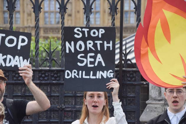 July 2, 2026, London, England, United Kingdom: Activists from Fossil Free London stage a protest outside the parliament calling on Andy Burnham, who is expected to become the next UK Prime Minister, not to open the North Sea to oil and gas projects like Jackdaw and Rosebank. London United Kingdom - ZUMAv130 20260702_zip_v130_002 Copyright: xVukxValcicx