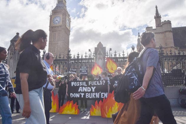 July 2, 2026, London, England, United Kingdom: Activists from Fossil Free London stage a protest outside the parliament calling on Andy Burnham, who is expected to become the next UK Prime Minister, not to open the North Sea to oil and gas projects like Jackdaw and Rosebank. London United Kingdom - ZUMAv130 20260702_zip_v130_007 Copyright: xVukxValcicx