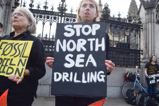 July 2, 2026, London, England, United Kingdom: Activists from Fossil Free London stage a protest outside the parliament calling on Andy Burnham, who is expected to become the next UK Prime Minister, not to open the North Sea to oil and gas projects like Jackdaw and Rosebank. London United Kingdom - ZUMAv130 20260702_zip_v130_016 Copyright: xVukxValcicx