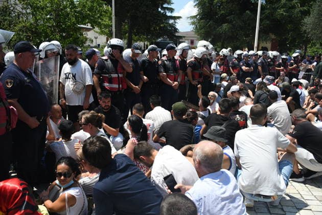 Protest over Zvernec Tourism Project held outside Albanian Parliament TIRANA, ALBANIA - JULY 2: Demonstrators protesting a planned tourism development project in the Zvernec area of Vlora gather outside the Albanian Parliament in Tirana on July 2, 2026, as protests that have continued for more than a month entered a new phase. Scuffles broke out between police and protesters during the demonstration. Protesters threw eggs and flour at police officers, members of parliament and parliamentary vehicles. Olsi Shehu Anadolu Tirana Albania. Editorial use only. Please get in touch for any other usage.  Copyright: x2026xAnadoluxOlsixShehux