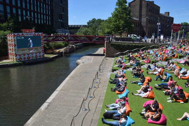 July 2, 2026, London, England, United Kingdom: People watch Wimbledon tennis matches on the large Everyman On The Canal screen in Granary Square next to Regent s Canal in King s Cross. The cinema chain sets up the screen, beanbags, a bar, and free sport and film screenings during the summer months. London United Kingdom - ZUMAv130 20260702_zip_v130_028 Copyright: xVukxValcicx