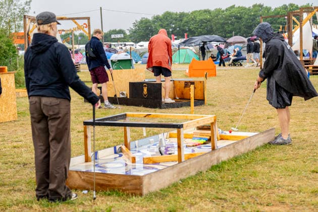 Roskilde Festival 2026 Mini-golf in the rain at Roskilde Festival, Thursday, July 2, 2026. (Photo: Ida Marie Odgaard Ritzau Scanpix) , Roskilde Denmark *** Roskilde Festival 2026 Mini golf in the rain at Roskilde Festival, Thursday, July 2, 2026 Photo by Ida Marie Odgaard, Ritzau Scanpix, Roskilde, Denmark  Copyright: RitzauxScanpix IdaxMariexOdgaardx spdk20260702-152427-L