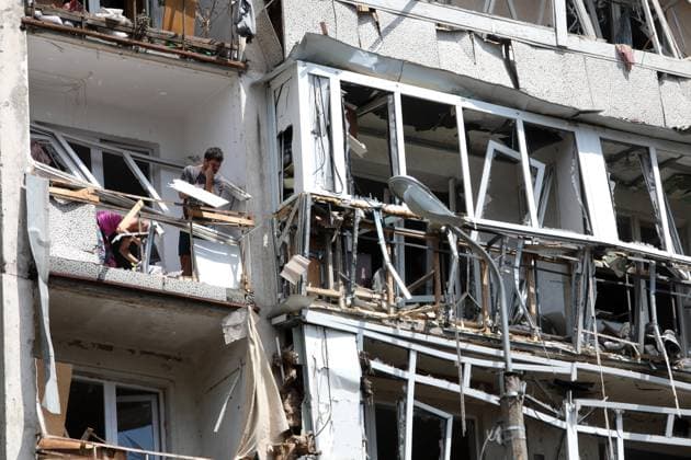 (260702) -- KIEV, July 2, 2026 -- Residents remove damaged windows in a building affected by a missile strike in Kiev, Ukraine, on July 2, 2026. At least 27 people were killed in a Russian attack on the Ukrainian capital on Thursday, Tymur Tkachenko, head of the Kiev City Military Administration, said. (Photo by Xinhua) UKRAINE-KIEV-MISSILE STRIKE-AFTERMATH PeterxDruk 