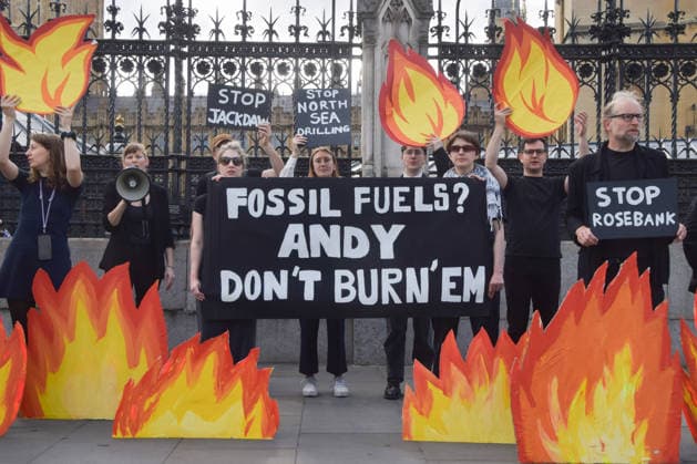 July 2, 2026, London, England, United Kingdom: Activists from Fossil Free London stage a protest outside the parliament calling on Andy Burnham, who is expected to become the next UK Prime Minister, not to open the North Sea to oil and gas projects like Jackdaw and Rosebank. London United Kingdom  - ZUMAv130 20260702_zip_v130_044 Copyright: xVukxValcicx