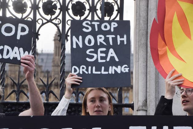 July 2, 2026, London, England, United Kingdom: Activists from Fossil Free London stage a protest outside the parliament calling on Andy Burnham, who is expected to become the next UK Prime Minister, not to open the North Sea to oil and gas projects like Jackdaw and Rosebank. London United Kingdom - ZUMAv130 20260702_zip_v130_045 Copyright: xVukxValcicx