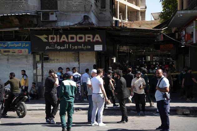 Damascus Cafe Blast Aftermath Investigated Syrian security personnel and members of the public gather in a commercial passage outside a cordoned-off cafe in central Damascus, Syria, on July 2, 2026. An explosive device detonated inside a cafe in the al-Hijaz area near the Palace of Justice, killing people and injuring others, Syrian authorities said. Damascus Damascus Syria Copyright: xOmarxAlbamx