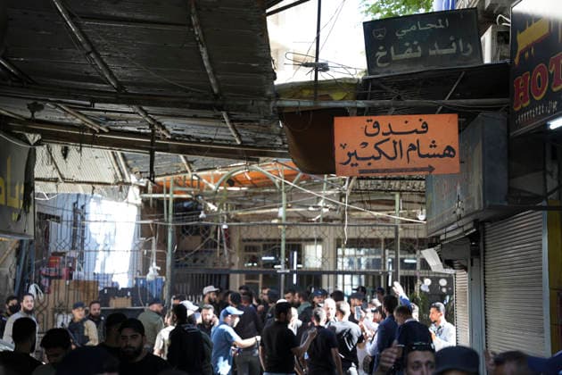 Damascus Cafe Blast Aftermath Investigated Syrian security personnel and members of the public gather in a commercial passage outside a cordoned-off cafe in central Damascus, Syria, on July 2, 2026. An explosive device detonated inside a cafe in the al-Hijaz area near the Palace of Justice, killing people and injuring others, Syrian authorities said. Damascus Damascus Syria Copyright: xOmarxAlbamx