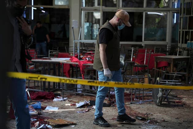 Damascus Cafe Blast Aftermath Investigated A man wearing gloves walks through the damaged interior of a cafe in central Damascus, Syria, on July 2, 2026. An explosive device detonated inside a cafe in the al-Hijaz area near the Palace of Justice, killing people and injuring others, Syrian authorities said. Damascus Damascus Syria Copyright: xOmarxAlbamx
