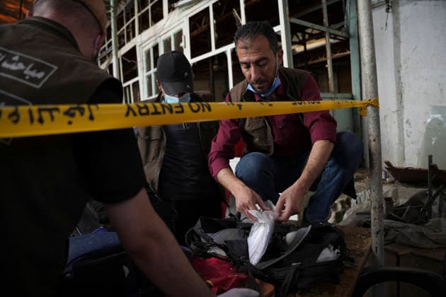 Damascus Cafe Blast Aftermath Investigated Forensic investigators examine items behind police tape inside a cafe in central Damascus, Syria, on July 2, 2026. An explosive device detonated inside the cafe near the Palace of Justice in the al-Hijaz area, killing people and injuring others, Syrian authorities said. Damascus Damascus Syria Copyright: xOmarxAlbamx