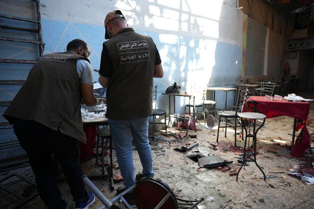 Damascus Cafe Blast Aftermath Investigated Forensic investigators inspect debris inside a damaged cafe in central Damascus, Syria, on July 2, 2026. An explosive device detonated inside the cafe near the Palace of Justice in the al-Hijaz area, killing people and injuring others, Syrian authorities said. Damascus Damascus Syria Copyright: xOmarxAlbamx