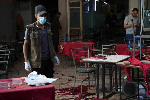 Damascus Cafe Blast Aftermath Investigated A forensic investigator wearing gloves walks through the damaged interior of a cafe in central Damascus, Syria, on July 2, 2026. An explosive device detonated inside the cafe near the Palace of Justice in the al-Hijaz area, killing people and injuring others, Syrian authorities said. Damascus Damascus Syria Copyright: xOmarxAlbamx