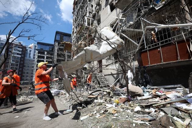 (260703) -- BEIJING, July 3, 2026 -- Municipal workers work at the site of a missile strike in Kiev, Ukraine, on July 2, 2026. At least 27 people were killed in a Russian attack on the Ukrainian capital on Thursday, Tymur Tkachenko, head of the Kiev City Military Administration, said. (Photo by Xinhua) XINHUA PHOTOS OF THE DAY PeterxDruk 