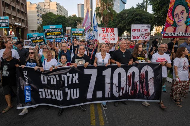 July 2, 2026, Tel Aviv, Israel: Protesters hold a banner and placards during an anti-government rally. A rally was held to mark 1,000 days since the October 7 massacre. Demonstrators protested against the Israeli government, accusing it of responsibility for the failures that led to the attack and calling for a state commission of inquiry, which they say the government opposes because its findings could implicate Prime Minister Benjamin Netanyahu. Tel Aviv Israel - ZUMAs197 20260702_aaa_s197_317 Copyright: xYaelxGuiskyxAbasx