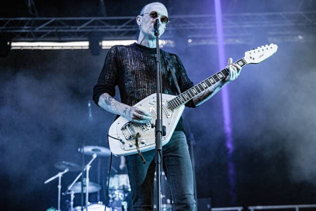 July 2, 2026, Soliera, Emilia Romagna, Italy: Singer and guitarist Craig Dyer of the British post-punk band The Underground Youth performs on stage during a concert. Singer and guitarist Craig Dyer performed on stage at Piazza Lusvardi in Soliera (Modena) during a concert by British post-punk band The Underground Youth. The event marked the opening night of the nineteenth edition of the Arti Vive Festival. Soliera Italy  - ZUMAs197 20260702_aaa_s197_414 Copyright: xCarloxVerganix