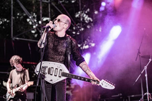 July 2, 2026, Soliera, Emilia Romagna, Italy: Singer and guitarist Craig Dyer of the British post-punk band The Underground Youth performs on stage during a concert. Singer and guitarist Craig Dyer performed on stage at Piazza Lusvardi in Soliera (Modena) during a concert by British post-punk band The Underground Youth. The event marked the opening night of the nineteenth edition of the Arti Vive Festival. Soliera Italy - ZUMAs197 20260702_aaa_s197_424 Copyright: xCarloxVerganix