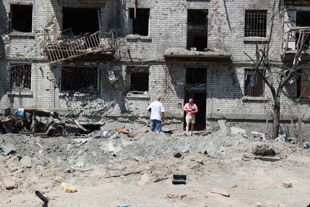 (260703) -- KIEV, July 3, 2026 -- People walk out of a residential building damaged by a missile strike in Darnytskyi district, Kiev, Ukraine, July 2, 2026. At least 27 people were killed in a Russian attack on the Ukrainian capital on Thursday, Tymur Tkachenko, head of the Kiev City Military Administration, said. Damage was reported across all districts of the city, Kiev Mayor Vitali Klitschko wrote on Telegram, adding that the heaviest destruction occurred in the Darnytskyi district, where part of an apartment building collapsed. ) (SpotNews) UKRAINE-KIEV-MISSILE STRIKE-AFTERMATH LixDongxu 