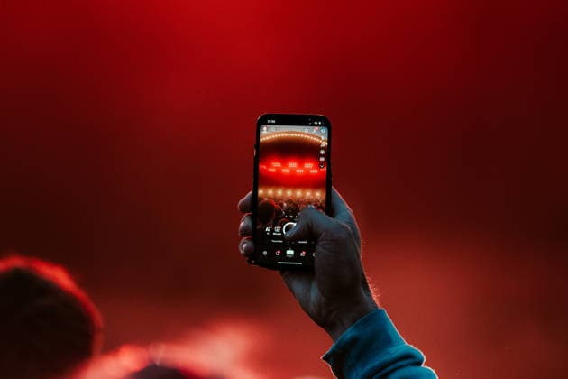 Gorillaz live at Roskilde Festival 2026 Roskilde, Denmark. 02nd, July 2026. A festival gooe seen with a smart phone at a live concert with the British band Gorillaz during the Danish music festival Roskilde Festival 2026 in Roskilde. Denmark, Roskilde  Copyright: xGonzalesxPhoto MathiasxKristensenx