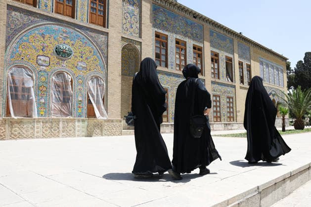 IRAN, TEHRAN - JULY 3, 2026: Women walk past the Golestan Palace on the eve of the state funeral of Supreme Leader Ali Khamenei (1939-2026) set to take place from July 4 to 9. Khamenei was killed in a joint US-Israeli airstrike on his residence on February 28 Tehran Iran  - ZUMAt113 20260703_zaa_t113_038 Copyright: xValeryxSharifulinx
