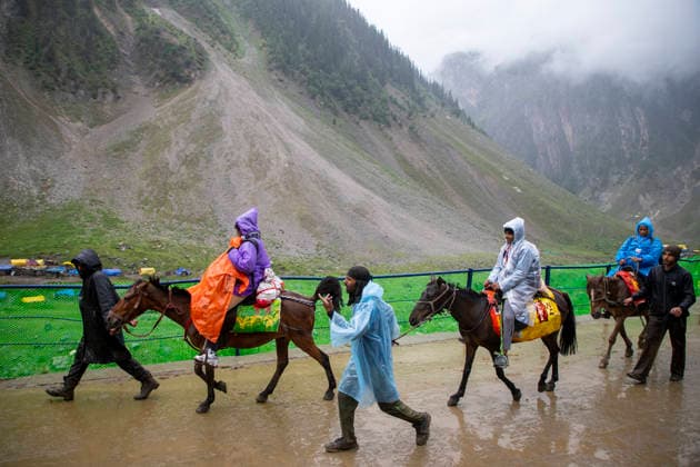 Annual Hindu Pilgrimage Amarnath Yatra begins in Baltal Sonamarg, India - 03 Jul 2026 Hindu devotees seen riding horses along a mountain path during the annual Amarnath pilgrimage to the cave shrine in Baltal some 100 km (62 miles) east of Srinagar. Thousands of Hindu pilgrims braving sub-zero temperatures begin the annual Amarnath Yatra trekking across glaciers, steep mountain trails and high altitude terrain to reach the sacred Amarnath cave shrine in the Himalayas of Indian-administered Kashmir. The cave houses a naturally formed ice stalagmite revered by devotees as a symbol of Lord Shiva, one of Hinduism s principal deities. The pilgrimage, which runs from July 3 to August 28 is expected to draw thousands of devotees making it one of H Copyright: xFaisalxBashirx xSOPAxImagesx 18AmarnathPilgrimage2026