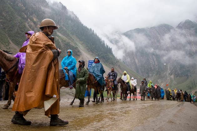Annual Hindu Pilgrimage Amarnath Yatra begins in Baltal Sonamarg, India - 03 Jul 2026 An India paramilitary soldier seen on guard as Hindu devotees make their way on foot, ride horses and are carried by porters along a mountain path during the annual Amarnath pilgrimage to the cave shrine in Baltal some 100 km (62 miles) east of Srinagar. Thousands of Hindu pilgrims braving sub-zero temperatures begin the annual Amarnath Yatra trekking across glaciers, steep mountain trails and high altitude terrain to reach the sacred Amarnath cave shrine in the Himalayas of Indian-administered Kashmir. The cave houses a naturally formed ice stalagmite revered by devotees as a symbol of Lord Shiva, one of Hinduism s principal deities. The pilgrimage, which Copyright: xFaisalxBashirx xSOPAxImagesx 11AmarnathPilgrimage2026