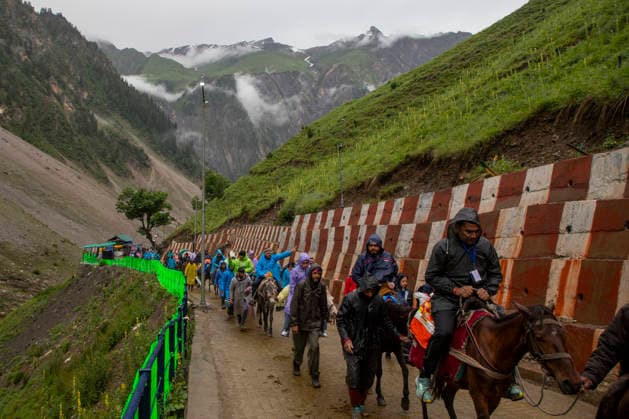 Annual Hindu Pilgrimage Amarnath Yatra begins in Baltal Sonamarg, India - 03 Jul 2026 Hindu devotees make their way along a mountain path during the annual Amarnath pilgrimage to the cave shrine in Baltal some 100 km (62 miles) east of Srinagar. Thousands of Hindu pilgrims braving sub-zero temperatures begin the annual Amarnath Yatra trekking across glaciers, steep mountain trails and high altitude terrain to reach the sacred Amarnath cave shrine in the Himalayas of Indian-administered Kashmir. The cave houses a naturally formed ice stalagmite revered by devotees as a symbol of Lord Shiva, one of Hinduism s principal deities. The pilgrimage, which runs from July 3 to August 28 is expected to draw thousands of devotees making it one of Hindu Copyright: xFaisalxBashirx xSOPAxImagesx 8AmarnathPilgrimage2026