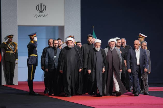 July 3, 2026, Tehran, Iran: Local and foreign officials walk past the coffins of Iran s slain supreme leader Ali Khamenei and his family members after paying their respects at the Grand Mosalla in Tehran on July 3, 2026. The body of Iran s supreme leader, killed in US-Israeli strikes that triggered the Middle East war, arrived at Tehran s Grand Mosalla on July 3 ahead of his funeral, state media reported. Millions of people and a coterie of foreign dignitaries were expected to attend Saturday s official ceremony for Ali Khamenei, with Tehran s chief negotiator calling for a massive turnout to avenge his death. Tehran Iran - ZUMAi98_ 20260703_zih_i98_044 Copyright: xIranianxSupremexLeader SxOfficex