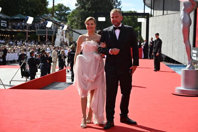 Czech moderator Libor Boucek, right, arrives at the opening of the 60th Karlovy Vary International Film Festival, on June 3, 2026, in Karlovy Vary, Czech Republic. (CTKxPhoto KaterinaxSulova) CTKPhotoP2026070306239  CTKPhotoP2026070306239