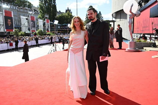 Slovak actress Tana Pauhofova, left, and her husband, musician Jonatan Pastircak arrive at the opening of the 60th Karlovy Vary International Film Festival, on June 3, 2026, in Karlovy Vary, Czech Republic. (CTKxPhoto KaterinaxSulova) CTKPhotoP2026070306314  CTKPhotoP2026070306314