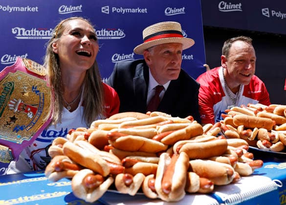 Past champions Miki Sudo and Jay Chestnut pose for a photo with Long-time Chairman and Commissioner of Major League Eating George Shea at the 110th Nathan s Famous Fourth of July International Hot Dog Eating Contest weigh-in ceremony at Hudson Yards on Friday, July 3, 2026 in New York City.  NYP202607032010 JOHNxANGELILLO