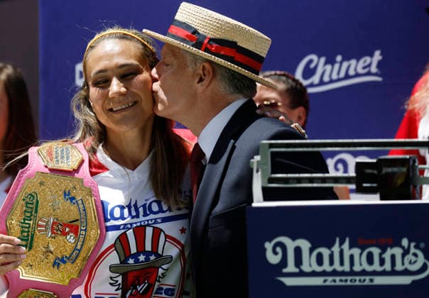 Past champion Miki Sudo is kissed by Long-time Chairman and Commissioner of Major League Eating George Shea at the 110th Nathan s Famous Fourth of July International Hot Dog Eating Contest weigh-in ceremony at Hudson Yards on Friday, July 3, 2026 in New York City.  NYP202607032011 JOHNxANGELILLO