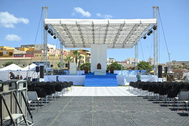 Daily life in Lampedusa before the arrival of Pope Leo XIV LAMPEDUSA, ITALY - JULY 3: A stage prepared for Pope Leo XIV is seen at a sports field ahead of his visit to Lampedusa on July 4, as local residents, security forces and NGOs prepare to welcome the pontiff while tourists and locals continue their daily summer activities in Lampedusa, Italy, on July 3, 2026. Valeria Ferraro Anadolu Lampedusa Italy. Editorial use only. Please get in touch for any other usage.  Copyright: x2026xAnadoluxValeriaxFerrarox