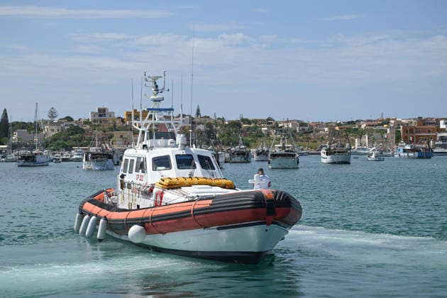 Daily life in Lampedusa before the arrival of Pope Leo XIV LAMPEDUSA, ITALY - JULY 3: An Italian Coast Guard patrol boat is seen at Favaloro Pier ahead of Pope Leo XIV s visit to Lampedusa on July 4, as local residents, security forces and NGOs prepare to welcome the pontiff while tourists and locals continue their daily summer activities in Lampedusa, Italy, on July 3, 2026. Valeria Ferraro Anadolu Lampedusa Italy. Editorial use only. Please get in touch for any other usage.  Copyright: x2026xAnadoluxValeriaxFerrarox