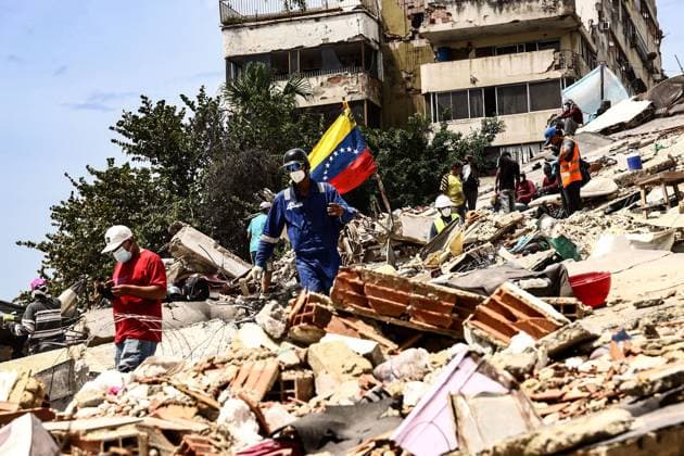 Relief and Rescue Operations Continue After Venezuela Earthquakes PLAYA GRANDE, CATIA LA MAR, LA GUAIRA, VENEZUELA JULY 3, 2026: Emergency responders, humanitarian organizations and volunteers continue relief, search and recovery operations in Playa Grande, Catia La Mar, La Guaira, Venezuela, following the devastating earthquakes that struck the country s northern Caribbean coast. Rescue teams remain deployed in affected neighborhoods while aid workers distribute emergency supplies and support displaced families as recovery efforts continue. According to the latest official figures, at least 2,295 people have been killed, more than 11,000 injured, and thousands displaced by the disaster. A GUAIRA Venezuela (Bolivarian Republic of) Copyright: x xLauraxdexChiclanax xJNAxPressx