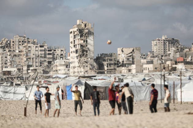 Gazan families gather along the Mediterranean amid rising summer temperatures GAZA, PALESTINE - JULY 3: Hundreds of displaced Palestinian families gather along the Mediterranean coastline in the Gaza Strip on July 3, 2026, seeking a respite from intense heatwaves and ongoing Israeli military operations. As temperatures soared across the enclave, thousands of residents fled the suffocating camps to swim and rest on the sandy beaches. Moiz Salhi Anadolu Gaza City Gaza. Editorial use only. Please get in touch for any other usage.  Copyright: x2026xAnadoluxMoizxSalhix