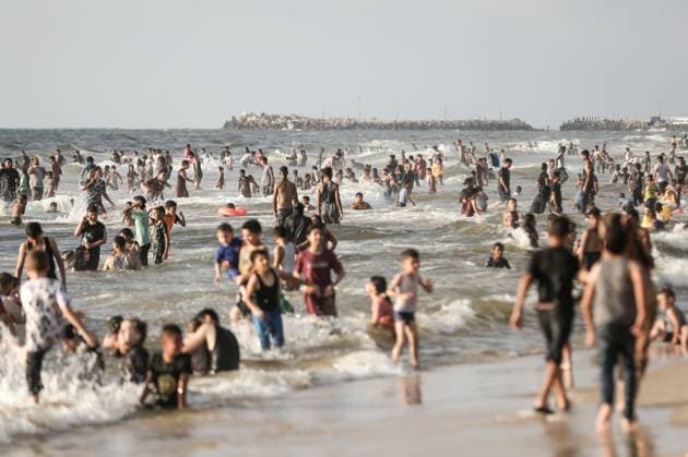 Gazan families gather along the Mediterranean amid rising summer temperatures GAZA, PALESTINE - JULY 3: Hundreds of displaced Palestinian families gather along the Mediterranean coastline in the Gaza Strip on July 3, 2026, seeking a respite from intense heatwaves and ongoing Israeli military operations. As temperatures soared across the enclave, thousands of residents fled the suffocating camps to swim and rest on the sandy beaches. Moiz Salhi Anadolu Gaza City Gaza. Editorial use only. Please get in touch for any other usage.  Copyright: x2026xAnadoluxMoizxSalhix