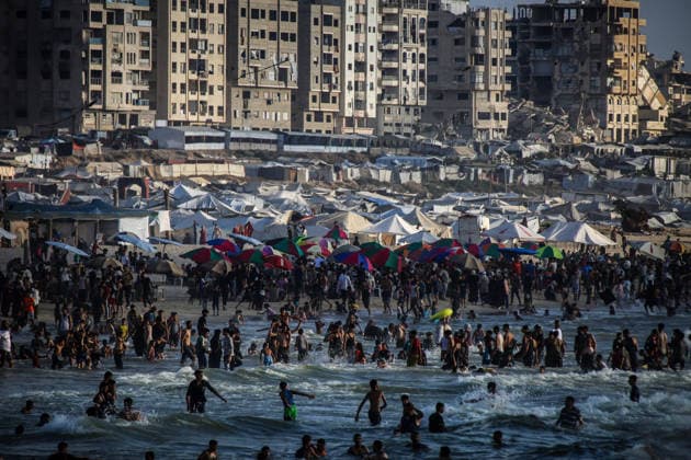 Palestinians flock to the coastline seeking relief from the heat GAZA CITY, GAZA, PALESTINE - JULY 03: As Israel s attacks on the Gaza Strip continues and soaring temperatures intensifies already harsh living conditions, Palestinians flock to the coastline seeking relief in Gaza City, Gaza, Palestine on July 03, 2026. Escaping the sweltering heat inside their tents, many sought relief by swimming off the coast of Gaza City, hoping to cool off and briefly escape the hardships of war. Saeed M. M. T. Jaras Anadolu Gaza City Gaza. Editorial use only. Please get in touch for any other usage.  Copyright: x2026xAnadoluxSaeedxM.xM.xT.xJarasx