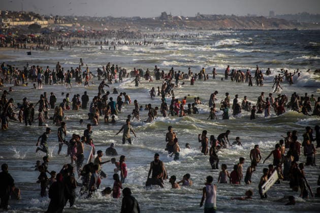 Palestinians flock to the coastline seeking relief from the heat GAZA CITY, GAZA, PALESTINE - JULY 03: As Israel s attacks on the Gaza Strip continues and soaring temperatures intensifies already harsh living conditions, Palestinians flock to the coastline seeking relief in Gaza City, Gaza, Palestine on July 03, 2026. Escaping the sweltering heat inside their tents, many sought relief by swimming off the coast of Gaza City, hoping to cool off and briefly escape the hardships of war. Saeed M. M. T. Jaras Anadolu Gaza City Gaza. Editorial use only. Please get in touch for any other usage.  Copyright: x2026xAnadoluxSaeedxM.xM.xT.xJarasx