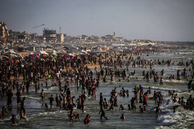 Palestinians flock to the coastline seeking relief from the heat GAZA CITY, GAZA, PALESTINE - JULY 03: As Israel s attacks on the Gaza Strip continues and soaring temperatures intensifies already harsh living conditions, Palestinians flock to the coastline seeking relief in Gaza City, Gaza, Palestine on July 03, 2026. Escaping the sweltering heat inside their tents, many sought relief by swimming off the coast of Gaza City, hoping to cool off and briefly escape the hardships of war. Saeed M. M. T. Jaras Anadolu Gaza City Gaza. Editorial use only. Please get in touch for any other usage.  Copyright: x2026xAnadoluxSaeedxM.xM.xT.xJarasx