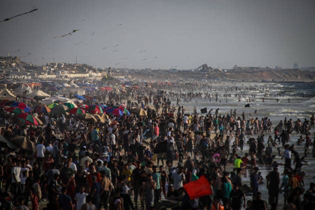 Palestinians flock to the coastline seeking relief from the heat GAZA CITY, GAZA, PALESTINE - JULY 03: As Israel s attacks on the Gaza Strip continues and soaring temperatures intensifies already harsh living conditions, Palestinians flock to the coastline seeking relief in Gaza City, Gaza, Palestine on July 03, 2026. Escaping the sweltering heat inside their tents, many sought relief by swimming off the coast of Gaza City, hoping to cool off and briefly escape the hardships of war. Saeed M. M. T. Jaras Anadolu Gaza City Gaza. Editorial use only. Please get in touch for any other usage.  Copyright: x2026xAnadoluxSaeedxM.xM.xT.xJarasx