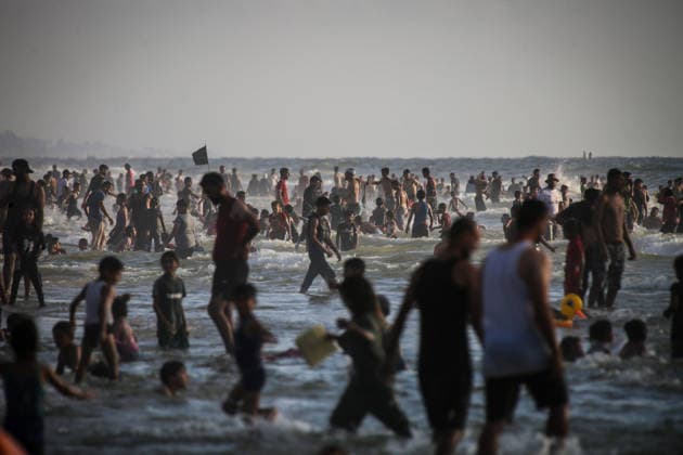 Palestinians flock to the coastline seeking relief from the heat GAZA CITY, GAZA, PALESTINE - JULY 03: As Israel s attacks on the Gaza Strip continues and soaring temperatures intensifies already harsh living conditions, Palestinians flock to the coastline seeking relief in Gaza City, Gaza, Palestine on July 03, 2026. Escaping the sweltering heat inside their tents, many sought relief by swimming off the coast of Gaza City, hoping to cool off and briefly escape the hardships of war. Saeed M. M. T. Jaras Anadolu Gaza City Gaza. Editorial use only. Please get in touch for any other usage.  Copyright: x2026xAnadoluxSaeedxM.xM.xT.xJarasx