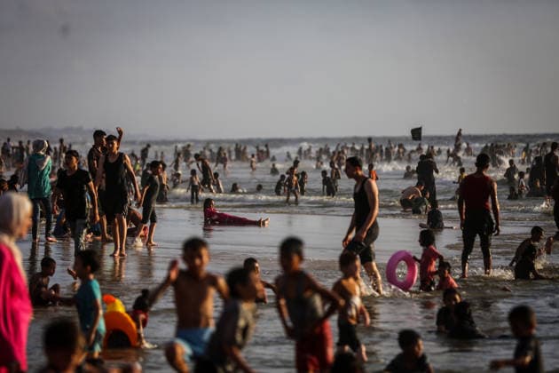 Palestinians flock to the coastline seeking relief from the heat GAZA CITY, GAZA, PALESTINE - JULY 03: As Israel s attacks on the Gaza Strip continues and soaring temperatures intensifies already harsh living conditions, Palestinians flock to the coastline seeking relief in Gaza City, Gaza, Palestine on July 03, 2026. Escaping the sweltering heat inside their tents, many sought relief by swimming off the coast of Gaza City, hoping to cool off and briefly escape the hardships of war. Saeed M. M. T. Jaras Anadolu Gaza City Gaza. Editorial use only. Please get in touch for any other usage.  Copyright: x2026xAnadoluxSaeedxM.xM.xT.xJarasx