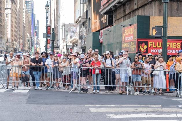July 3, 2026, Bronx, New York, USA: Swifties, fans of Taylor Swift observe as celebrity guests arrive at Taylor Swift and Travis Kelce s wedding event at Madison Square Garden in New York, NY on July 3, 2026 with tight security around and blocked streets with metal barricades, Heavy presence of hundreds of police officers, some with military style weapons. All guests arrive on foot or in black cars and checked by security before entering venue. Guests who were invited have and display special QR code for check. Bronx USA - ZUMAr339 20260703_znp_r339_038 Copyright: xLevxRadinx